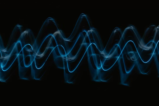 Blue frequency wave on dark background